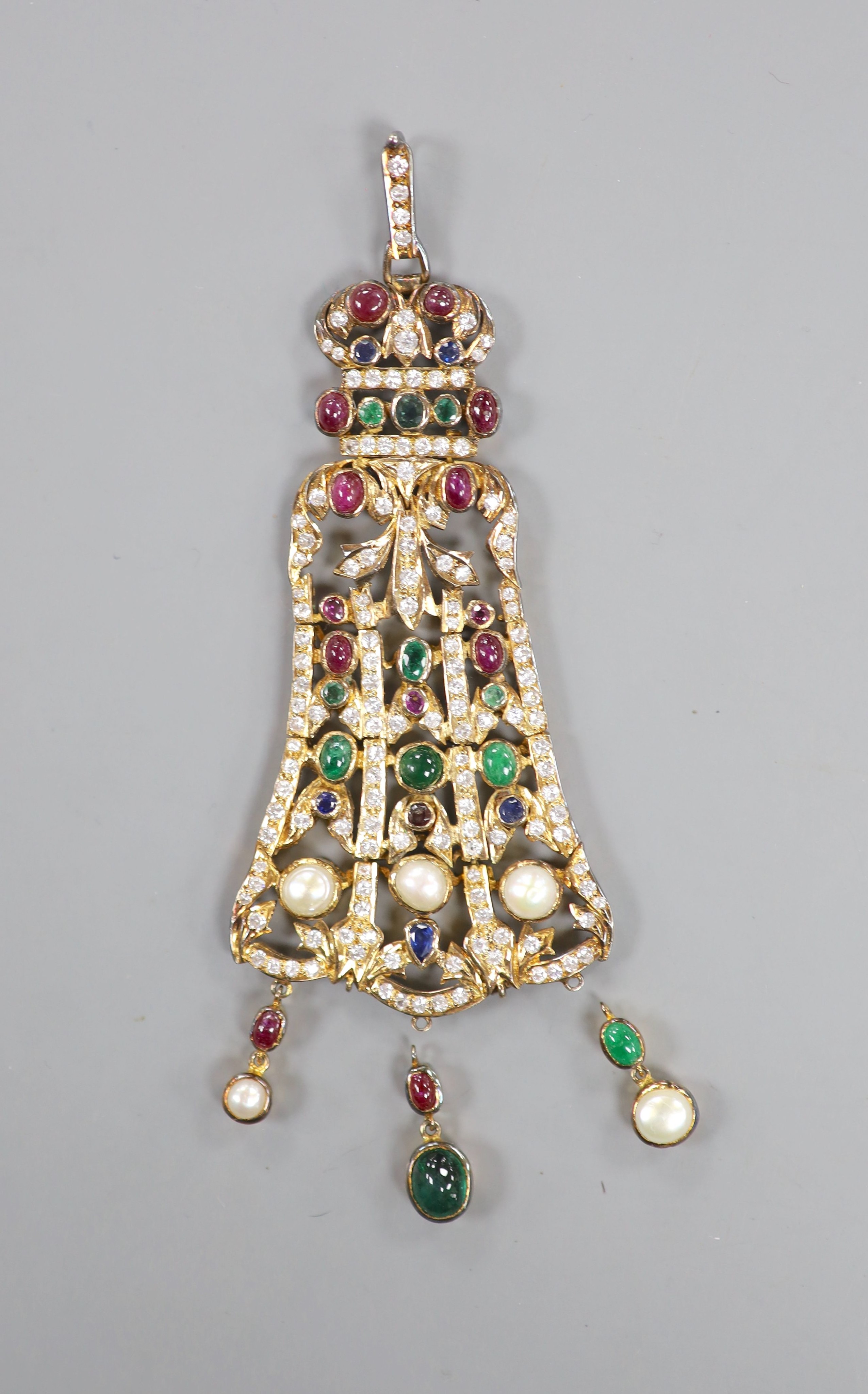 An Indian gilt metal and multi gem set drop pendant, with two loose drops, 12.7cm.